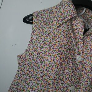 Sleeveless button front with pockets